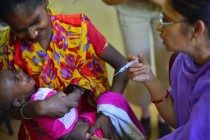 Vaccination doses being administered orally and through injectio